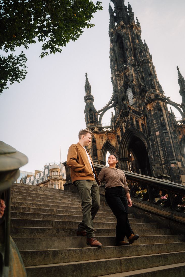 Couple walking down the Scott Monument steps